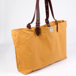 Tote bag with leather belt straps